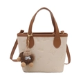 Fashionable cream and brown tote bucket bag with SMNL embossed patterns and plush charm - With Charm / White