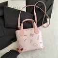 Pink mini crossbody bucket bag with cartoon prints and adjustable shoulder strap - No Pendant / Pink