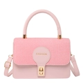Pink minimalist crossbody bag with woven texture flap and golden hardware on white background - Pink