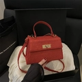 Sparkly red glitter handbag with gold turn-lock closure in premium gift box presentation - Red