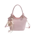Pink wave-edged leather bucket bag with a plush bear charm and rope handle detail - Pink With Pendant