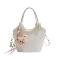 White leather bucket bag with a plush bear charm and knotted top handle detail - White With Pendant