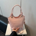 Pink leather bucket bag with wavy rim, gold ring buckle, and knotted handle detail - No Pendant / Pink