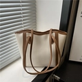 Chic beige tote bag with brown trim and long handles for daily commuting and work - White
