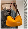 Detail of yellow canvas dumpling bag with striped wide strap and logo print - Yellow