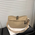 Chic beige canvas crescent shoulder bag with adjustable wide strap and dual zippers - Khaki