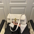Minimalist creamy white leather baguette bag with elegant golden metallic twist buckle - White