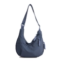 Waterproof dusky blue nylon crescent bag with adjustable strap and braided zipper detail - Blue