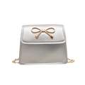 Silver mini crossbody bag with gold bow clasp and metal chain strap on white background - Silver
