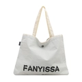 White textured canvas tote bag featuring FANYISSA black letter print and button - White