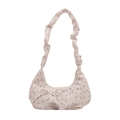 Pink floral shoulder bag with ruched cloud strap and bow accents on white background - White