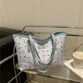 Grande borsa tote bianca a bolle con stampe a fiocco nero e manici blu per il pendolarismo - Blu