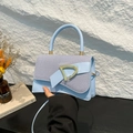Light blue crossbody handbag with denim texture flap and large gold metal buckle - Blue
