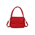 Red lychee grain PU leather saddle bag with top handle and detachable strap on white background - Red