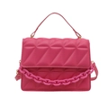 Magenta quilted crossbody bag with acrylic chain link and top handle on white background - Pink