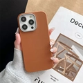 Detail of caramel brown leather iPhone 15 Pro Max case with silver metal camera frame - Brown / iPhone XR