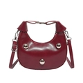 Dark red crescent shoulder bag featuring three silver spherical studs and a top handle - Red