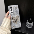 Detail of silver glitter phone case featuring a 3D heart mirror and rhinestone accents - Matte Hard Shell - Silver Grey Drip Glue - Pleated Heart Mirror / Samsung ZFlip3