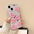 Close-up of a glittery transparent iPhone case with pink 3D heart and star charms. - 7/8/SE 2020 / Striped Star Heart