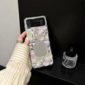 Detail view of foldable phone case with rhinestone flowers and built-in vanity mirror - Samsung ZFold3 / Matte Hard Case / Pink