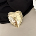Macro shot of gold heart phone stand with unique crinkled tin foil metal texture - Heart Shape - Shiny Gold / Gold