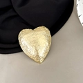 Detailed view of champagne gold heart phone grip with unique crumpled metal texture - Heart Shape - Matte Gold / Gold