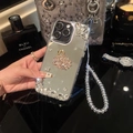 Close-up of silver mirror iPhone case with rhinestone swan and beaded wrist strap - Mirror Swan Pink (With Beaded Chain) / iPhone 7/8/SE 2020