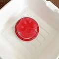 Macro shot of red cat paw magnetic phone grip with heart shape and Good Luck base - Matte Cat Paw - Red
