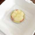 Detailed macro of a yellow cat paw shape holder with heart motif and Good Luck text - Matte Cat Paw - Yellow