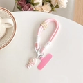 Detailed view of pink woven phone lanyard with heart fish charm and handmade leather tag - Soft Pink (Smile Lanyard + Gradient Fishbone) / Pink