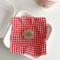Detail of a translucent gradient cat paw phone grip featuring a heart detail on fabric - Sandwich Jasmine Green