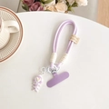 Detail of purple woven phone lanyard with heart fishbone charm and handmade tag - Purple