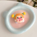 Detail of cute cartoon girl phone grip and mirror on a bear-shaped ceramic tray - Playful Yellow Twin Tails (Girl No. 7)