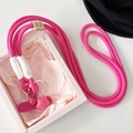 Dettaglio del cordino rosa intrecciato per cellulare con ciondolo a stella - Rosa Rosso