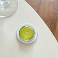 Detail of green lime fruit slice phone socket with glossy clear resin coating - Magnetic Crystal Glass Lemon Slice