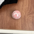 Detail of pink plush ball phone socket with pearl bow decoration inside acrylic shell - Transparent Stand-Mink Fur Bow-Pink
