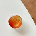 Macro shot of realistic orange fruit pattern on circular magnetic phone socket grip - Transparent Stand Crystal Glass Orange