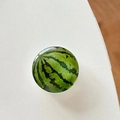 Close-up of realistic 3D watermelon phone grip with smooth polished resin finish - Transparent Stand Crystal Glass Watermelon