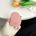 Close-up of pink leather mango-shaped phone grip with C'est la vie embossed text - Pink