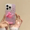 Coque iPhone rose pailletée avec nœud 3D et lettrage Sweet tenue par une main - Rose / iPhone 7/8/SE 2020