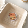 Detail showing cartoon bear burger pattern on a magnetic phone socket grip stand - Magnetic Versatile Capybara No.2 (Hamburger Style)