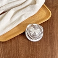 Detail showing a heart-shaped clear phone socket with 3D bow design on wood tray - No.3 White 3D Bow