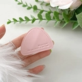 Macro detail of pink lychee leather phone stand with mountain pattern and debossed text - Light Pink