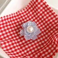 Detail of lavender floral phone socket with pearlescent petals and a white pearl center - Light Blue