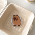 Close-up of cute cartoon capybara acrylic phone grip with strong magnetic suction back - Magnetic Versatile Capybara No.8 (Laying Pose Style)