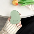 Close-up of mint green lychee leather phone socket in mango shape with embossed text - Green