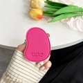 Detail of rose pink leather phone grip showing fine litchi texture and stamped quote - Rose Red