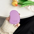 Detail of purple faux leather mango phone grip with embossed text and stitching - Purple