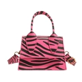 Mini crossbody handbag with vibrant pink zebra print and stylish gold hardware - Rose Red