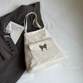 Chic beige tote bag with marble texture finish and butterfly metal buckle detail - Off-white without Charm
